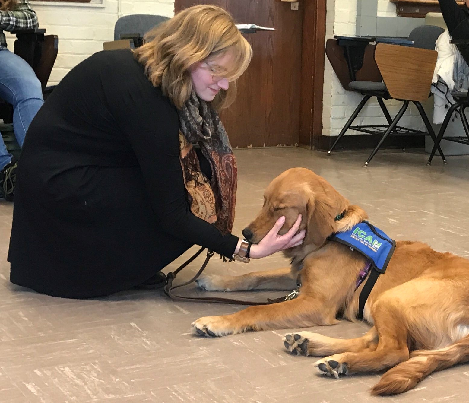 Clare Jensen with a service dog