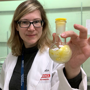 dr. fortin holding a beaker