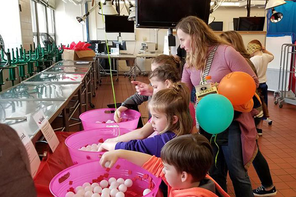 attendees enjoying activities at the open house event